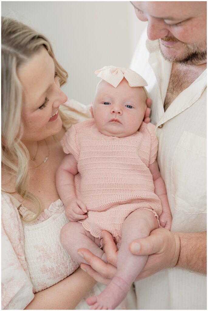 "Newborn baby sleeping peacefully on a soft white blanket."

"CloseJordan Rivera Photography lifestyle newborn session in Houston home, capturing parents cuddling their baby in natural light."

"Authentic family moments during an in-home newborn lifestyle session by Jordan Rivera Photography in Houston."

"New parents lovingly holding their newborn in cozy home setting, photographed by Jordan Rivera Photography."

"Candid Houston lifestyle newborn photography by Jordan Rivera Photography, showing family connection and warmth."

"Natural light lifestyle newborn portraits by Jordan Rivera Photography, capturing intimate family moments at home in Houston."-up of a swaddled newborn baby with eyes closed."

"Newborn lying in a wicker basket with a knitted blanket."

"Baby girl wearing a pink headband, sleeping on her stomach."

"Father holding newborn gently against his chest."

"Newborn twins wrapped in matching blankets, sleeping side by side."

"Black and white photo of a newborn holding a parent's finger."

"Newborn baby yawning while lying in a cozy, neutral-toned setting."
"Big brother gently kissing newborn sibling on the forehead as parents look on smiling."

"Family of four sitting on a bed, with the big brother holding the newborn baby in his lap."

"Parents cuddling their newborn while big brother sits beside them, smiling at the baby."

"Big brother lying next to his newborn sibling on a cozy blanket during a family photo shoot."

"Mother holding newborn baby while big brother stands beside her with his arm around her shoulder."

"Father cradling newborn in his arms while big brother peeks over to look at the baby."

"Black and white photo of big brother holding newborn, surrounded by loving parents."